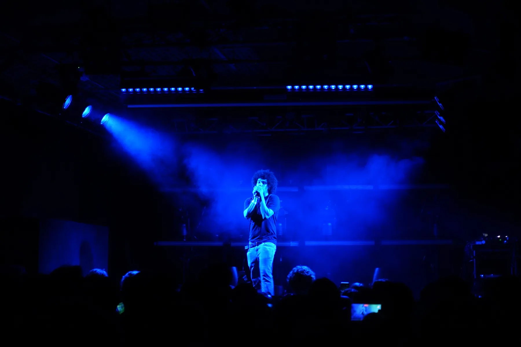 Performer in blue stage light