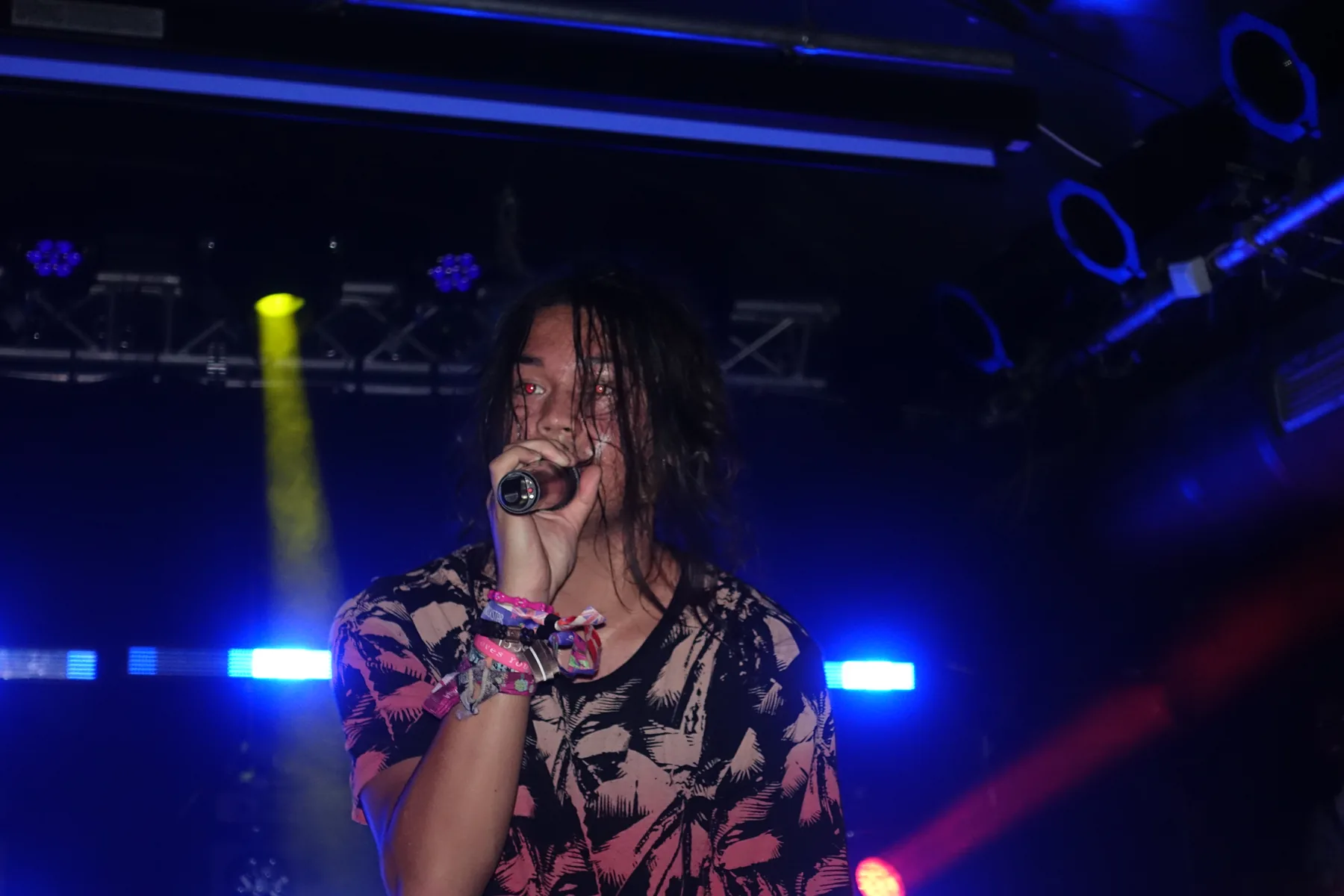 Singer on stage in blue light