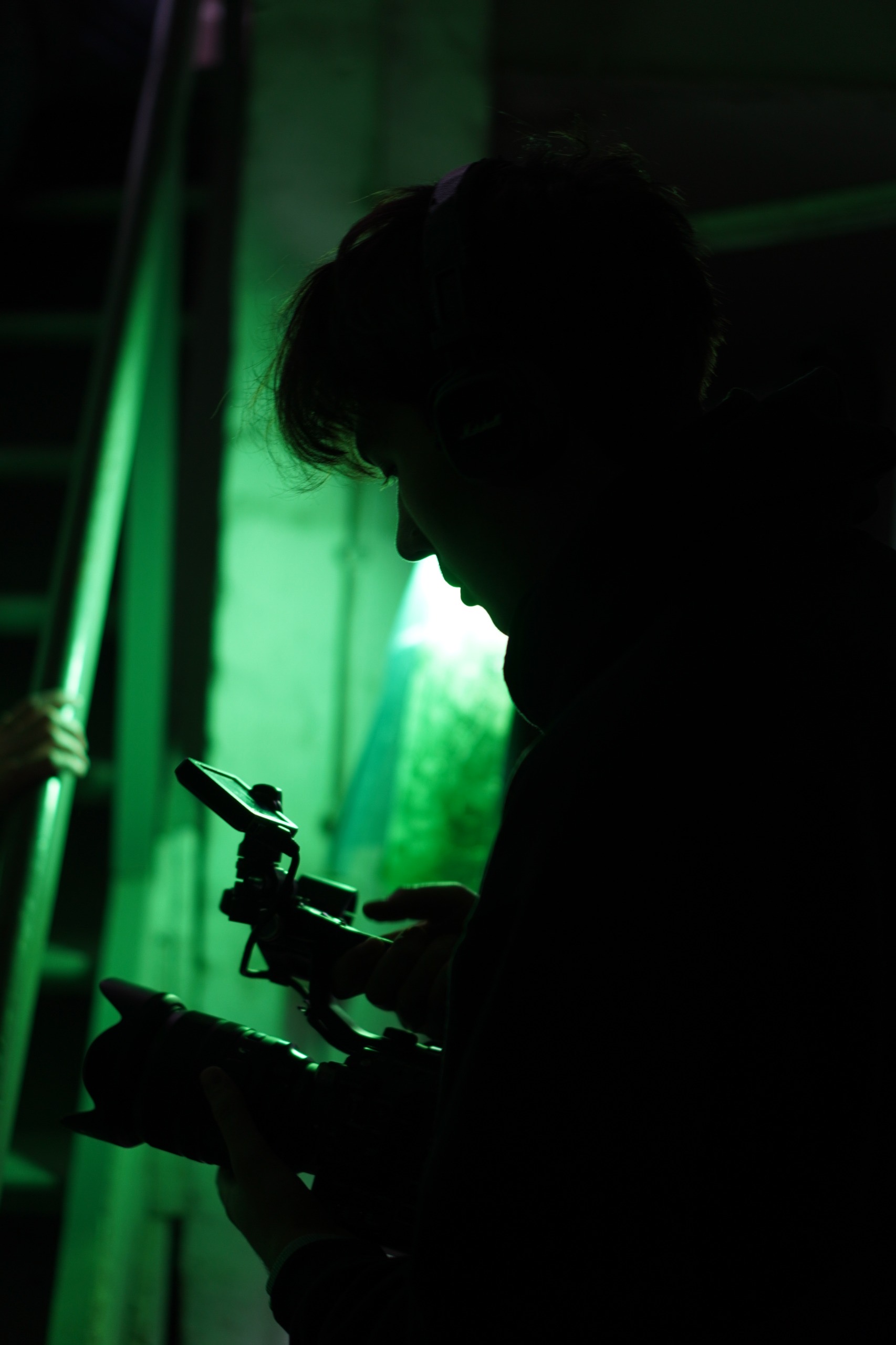 Kostiantyn Chernobai working with a camera in green light